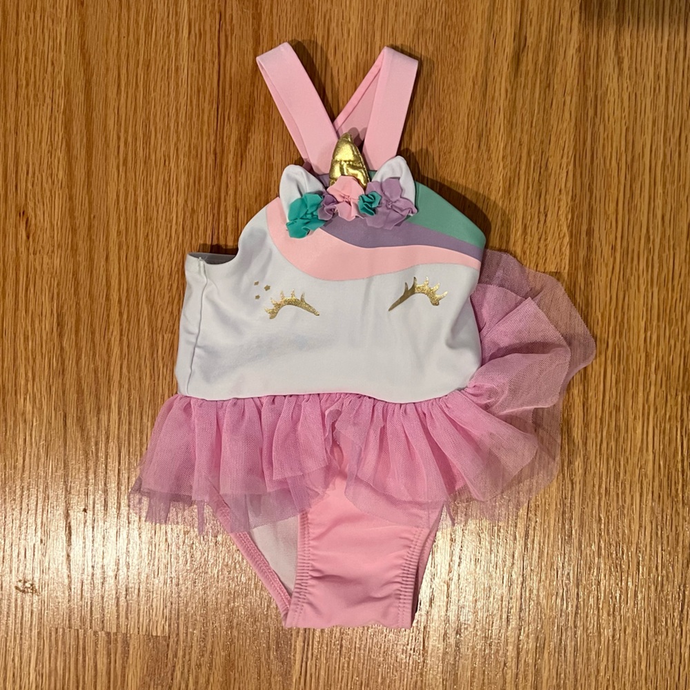 Unicorn baby swim suit, runs small